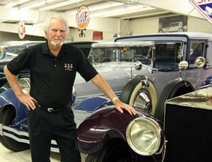 Bestselling Author Clive Cussler with his automobile collection Photo G.P. Putnam’s Sons